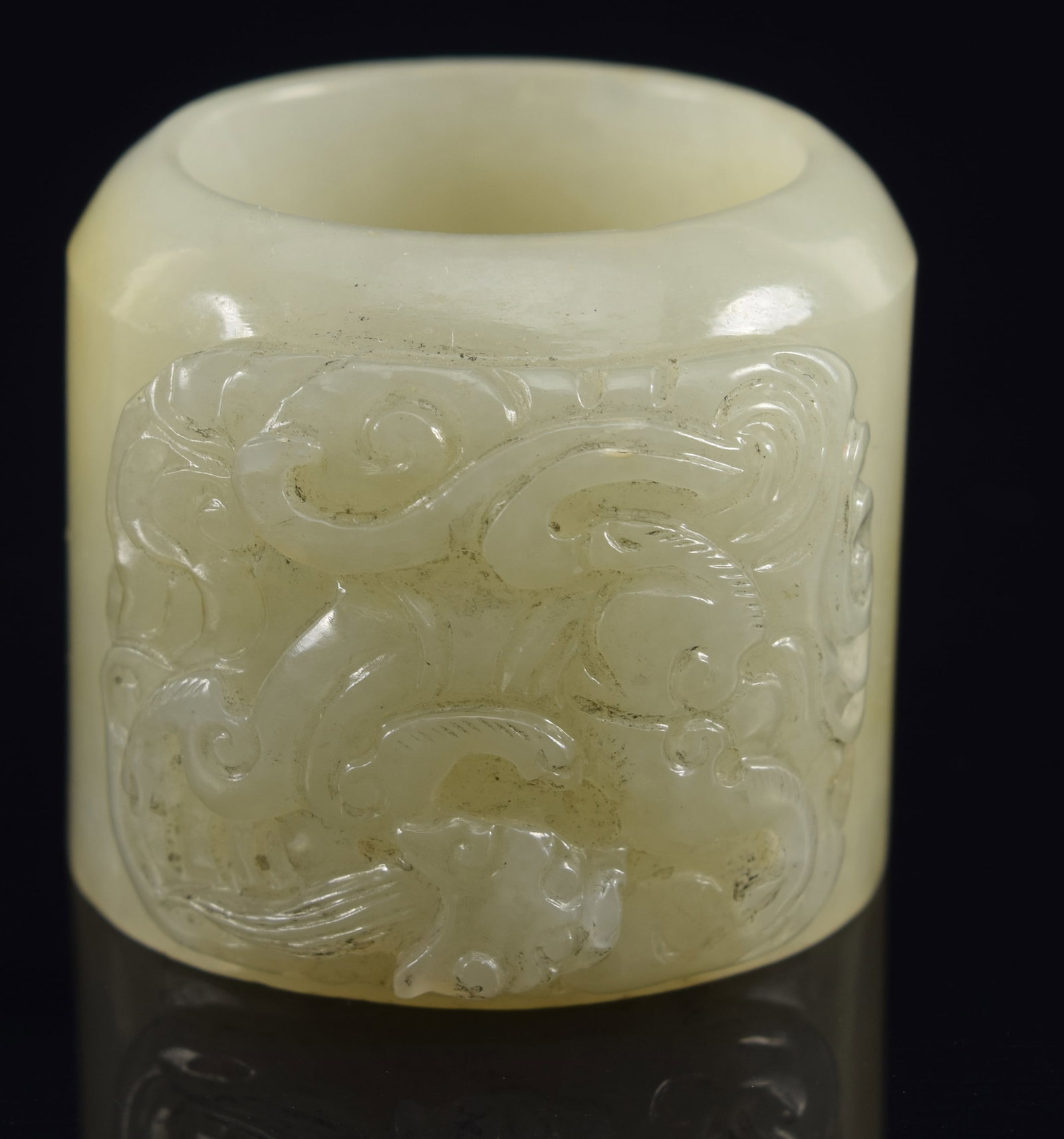 Jade archer's ring. China. 18th century. Surface carved with dragon and clouds. Grey-celadon color. (1 of 7)