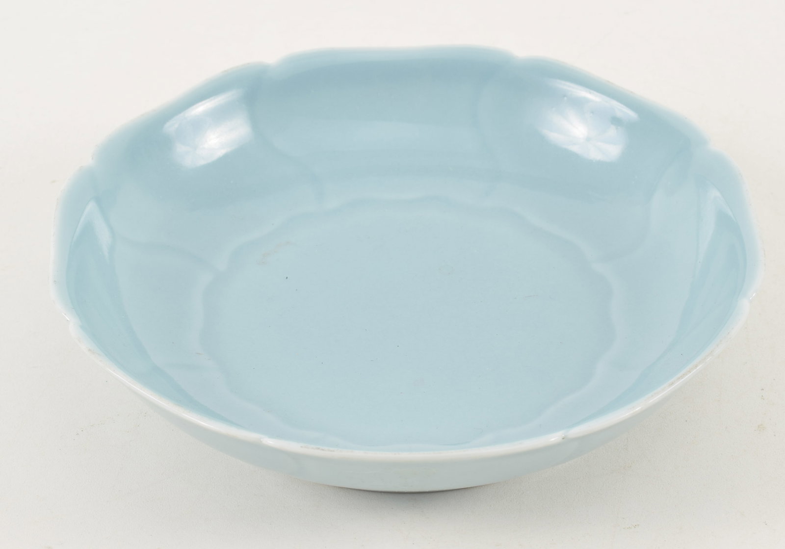 Early 20th century Chinese petal form dish in "Ru" ware style blue glaze. Underglaze blue Yung Cheng: Early 20th century Chinese petal form dish in "Ru" ware style blue glaze. Underglaze blue Yung Cheng seal on underside. 6 7/8in diameter.