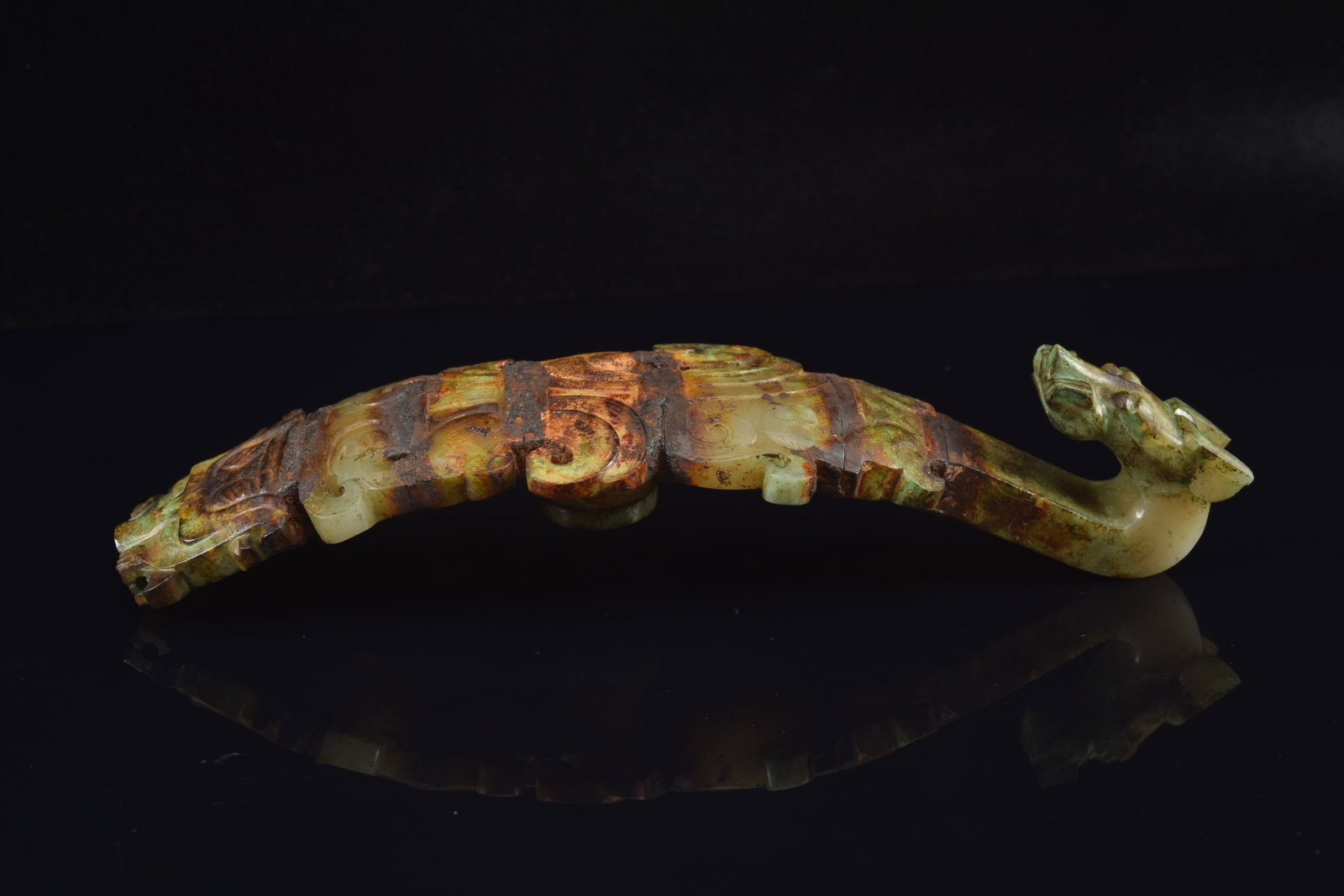 Garment hook. China. Waring states period. Burial patina with areas of bronze coloring the jade. - 5