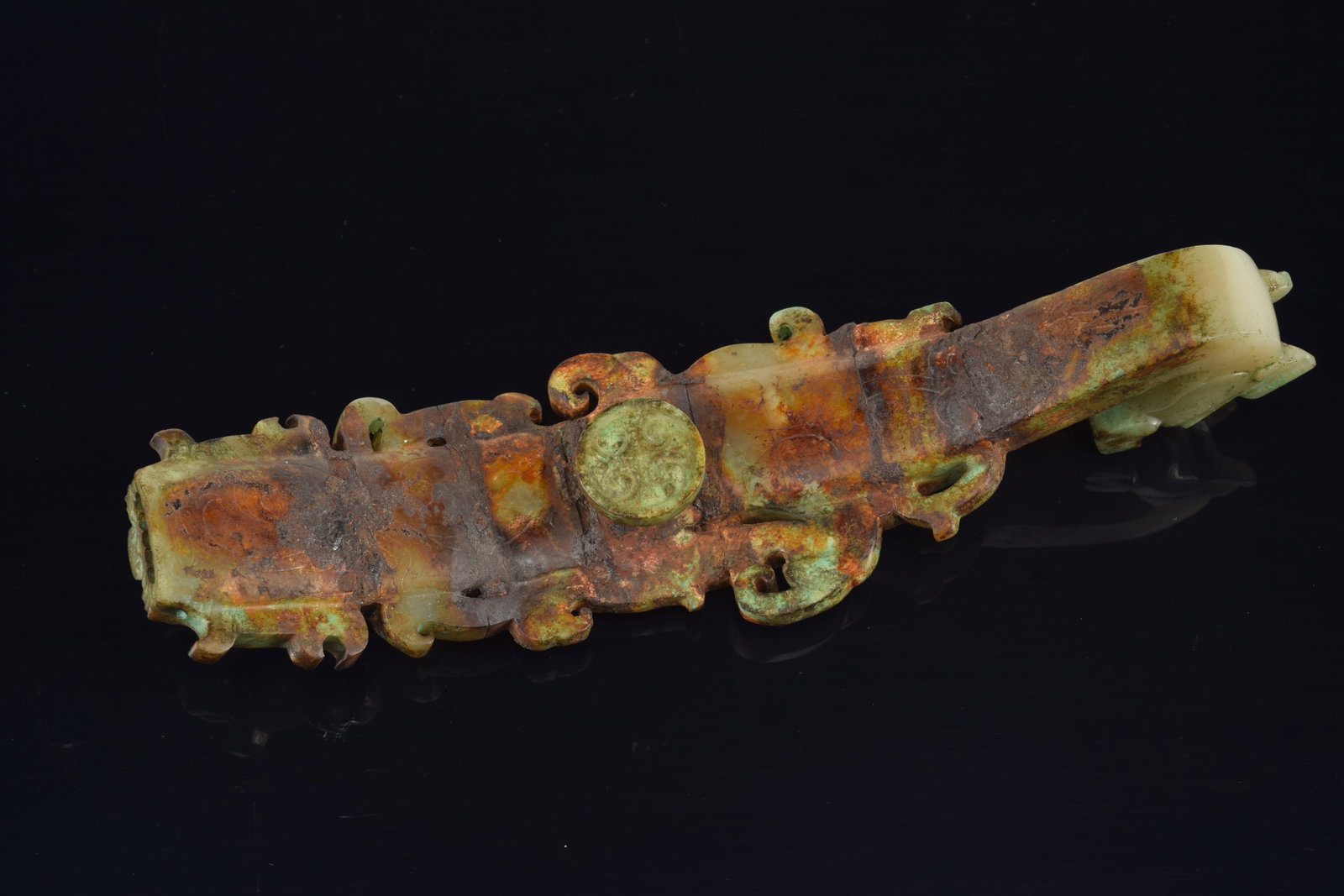 Garment hook. China. Waring states period. Burial patina with areas of bronze coloring the jade. - 6