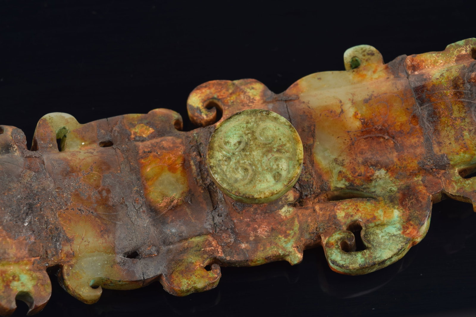 Garment hook. China. Waring states period. Burial patina with areas of bronze coloring the jade. - 7