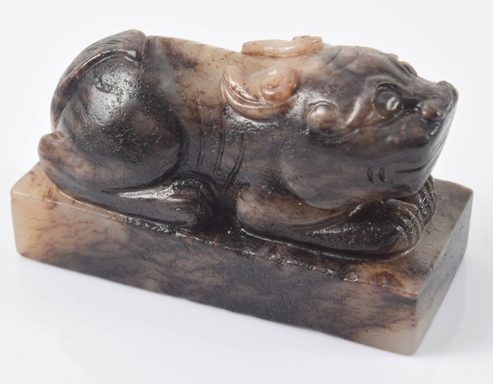 Jade paperweight. China. 18th century. Black stone with slight celadon markings. 2.5in length.: Jade paperweight. China. 18th century. Black stone with slight celadon markings. 2.5in length.