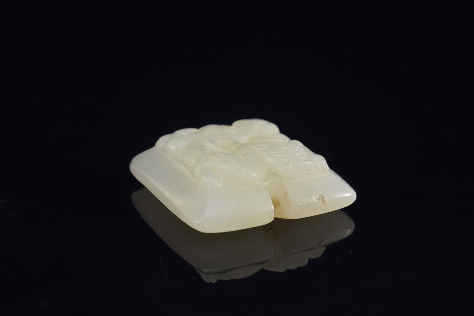 Jade pendant. China. 18th century. Surface carved with chih lung. 1.5in. - 2