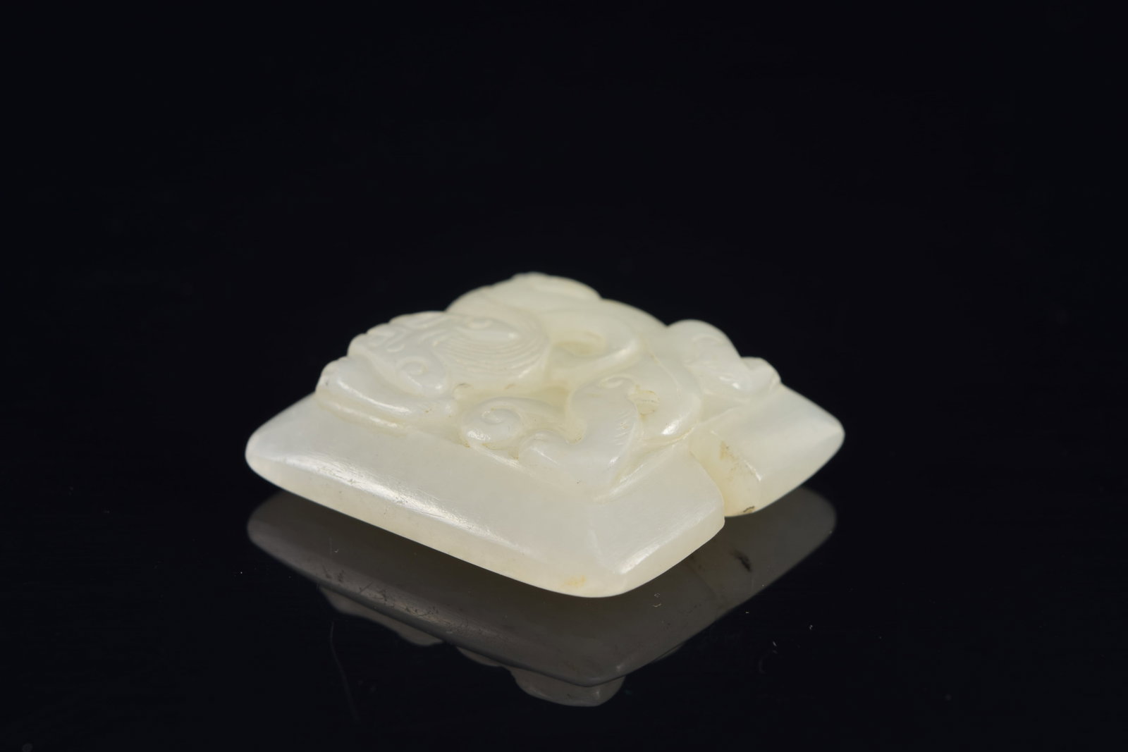 Jade pendant. China. 18th century. Surface carved with chih lung. 1.5in. - 3