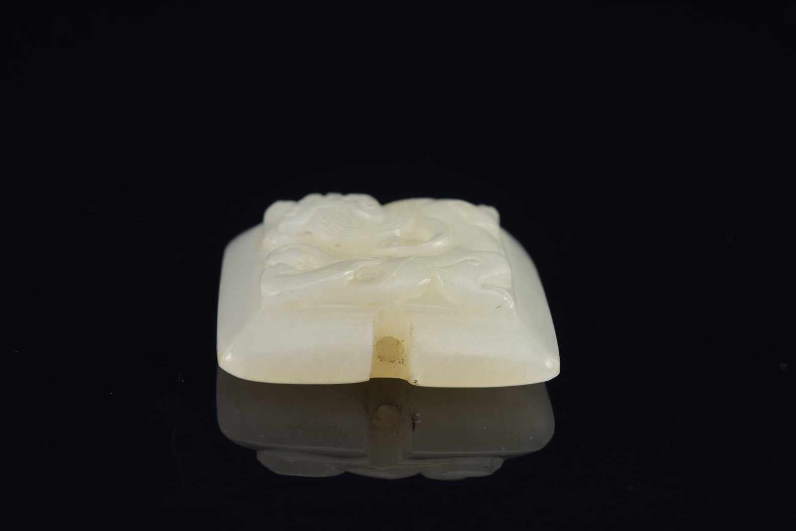 Jade pendant. China. 18th century. Surface carved with chih lung. 1.5in. - 4