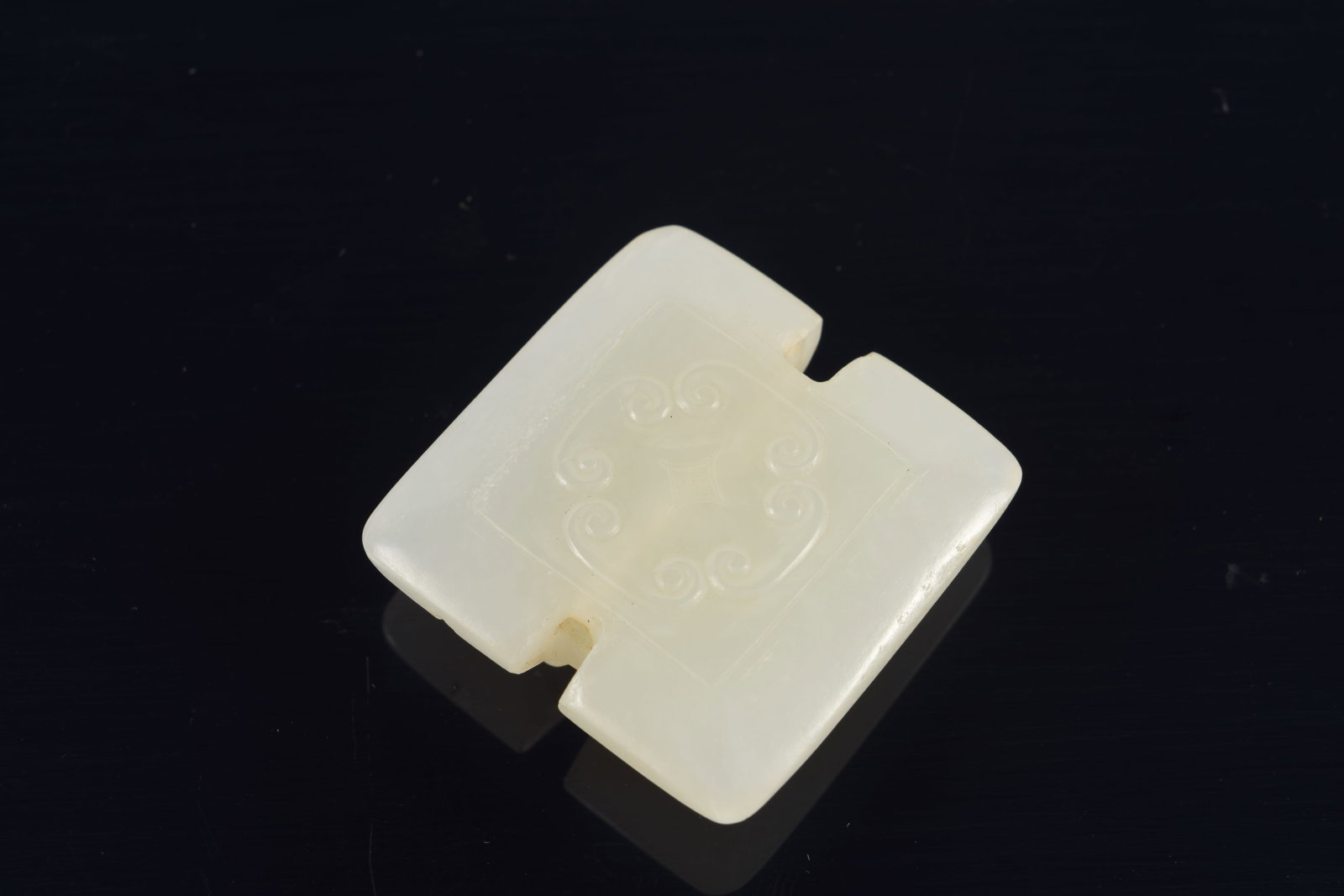 Jade pendant. China. 18th century. Surface carved with chih lung. 1.5in. - 5