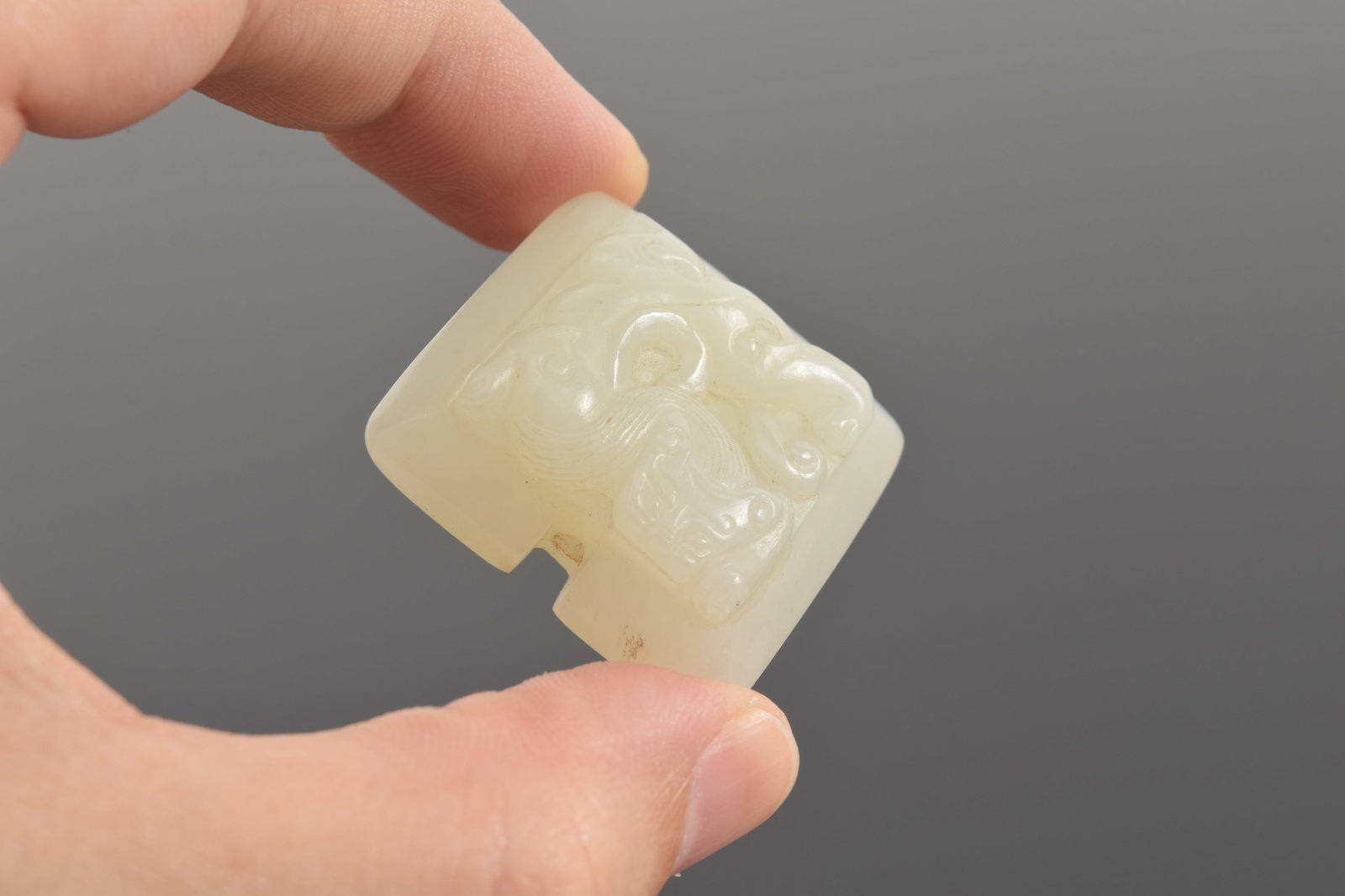 Jade pendant. China. 18th century. Surface carved with chih lung. 1.5in. - 6