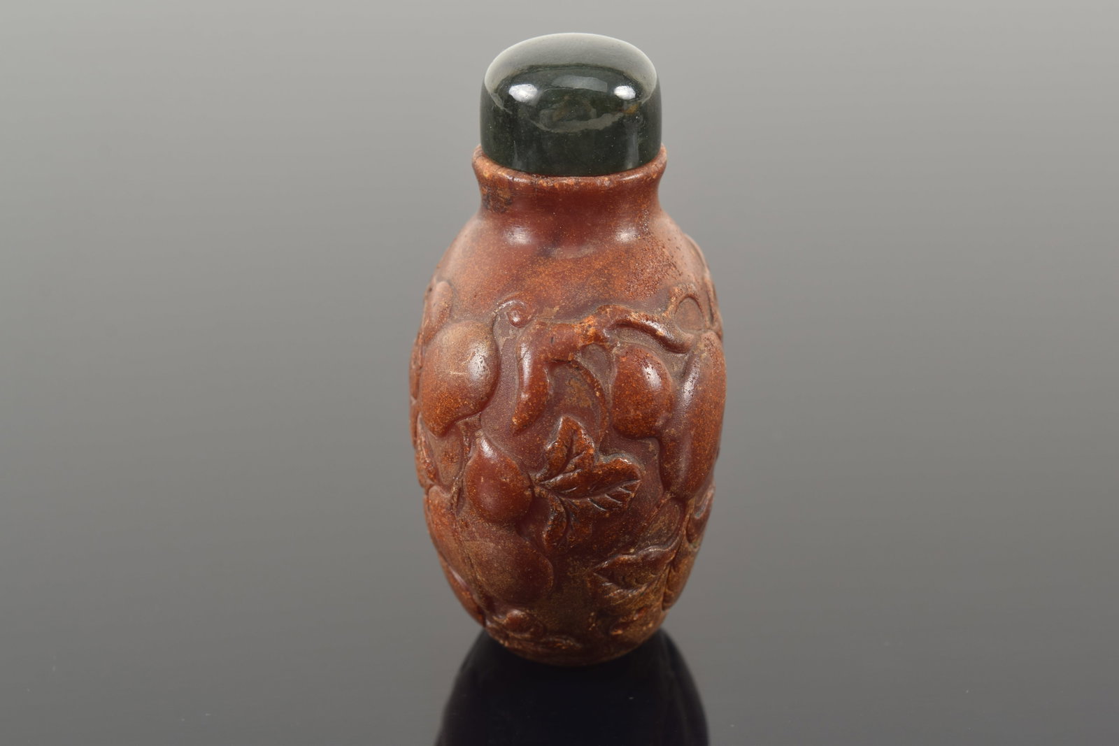 19th century Chinese carved amber snuff bottle. Allover fruit decoration. Chips around top rim. - 2