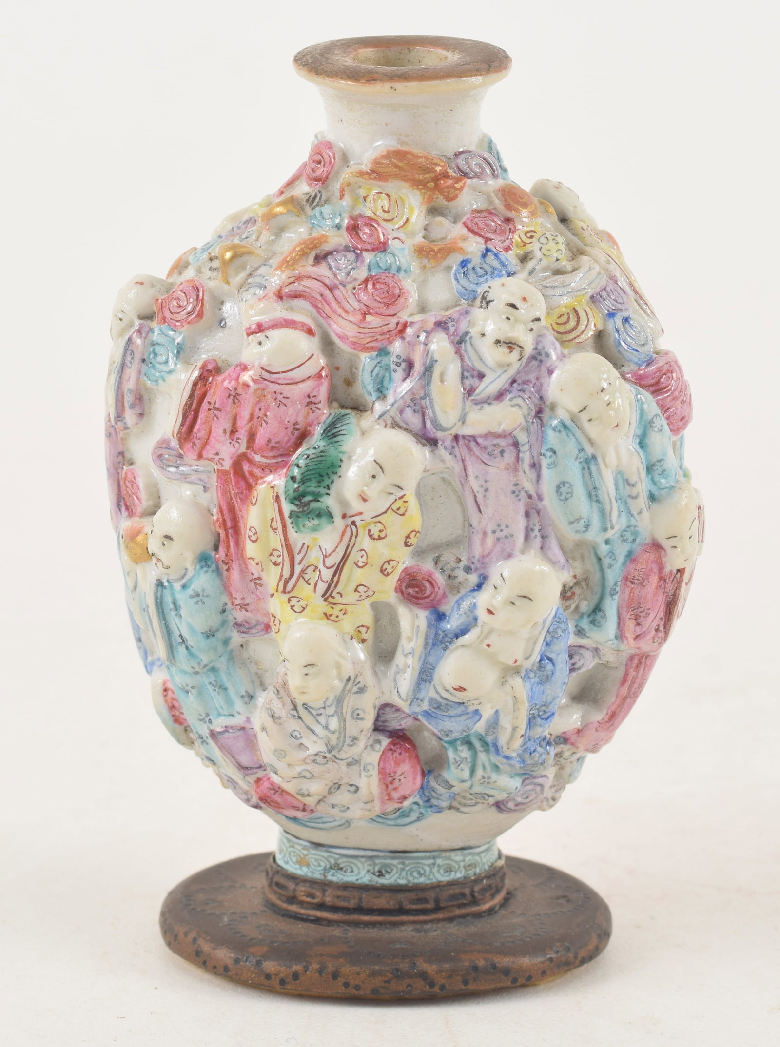 19th century Chinese porcelain snuff bottle. Polychrome carved and molded with a design of the (1 of 6)