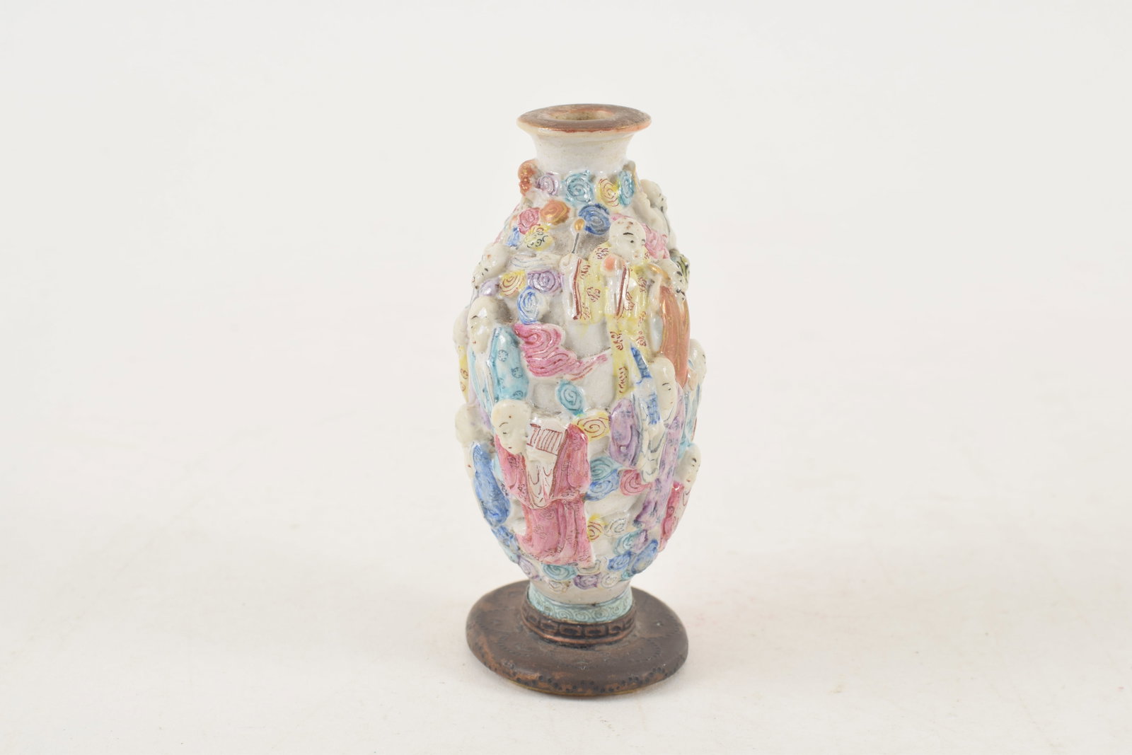 19th century Chinese porcelain snuff bottle. Polychrome carved and molded with a design of the - 2