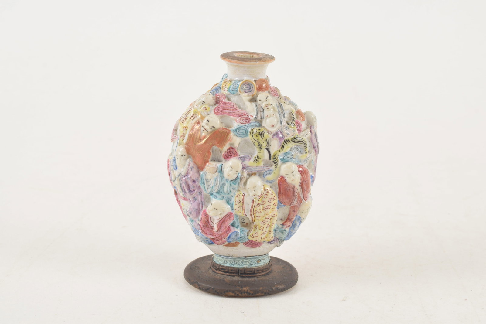 19th century Chinese porcelain snuff bottle. Polychrome carved and molded with a design of the - 3