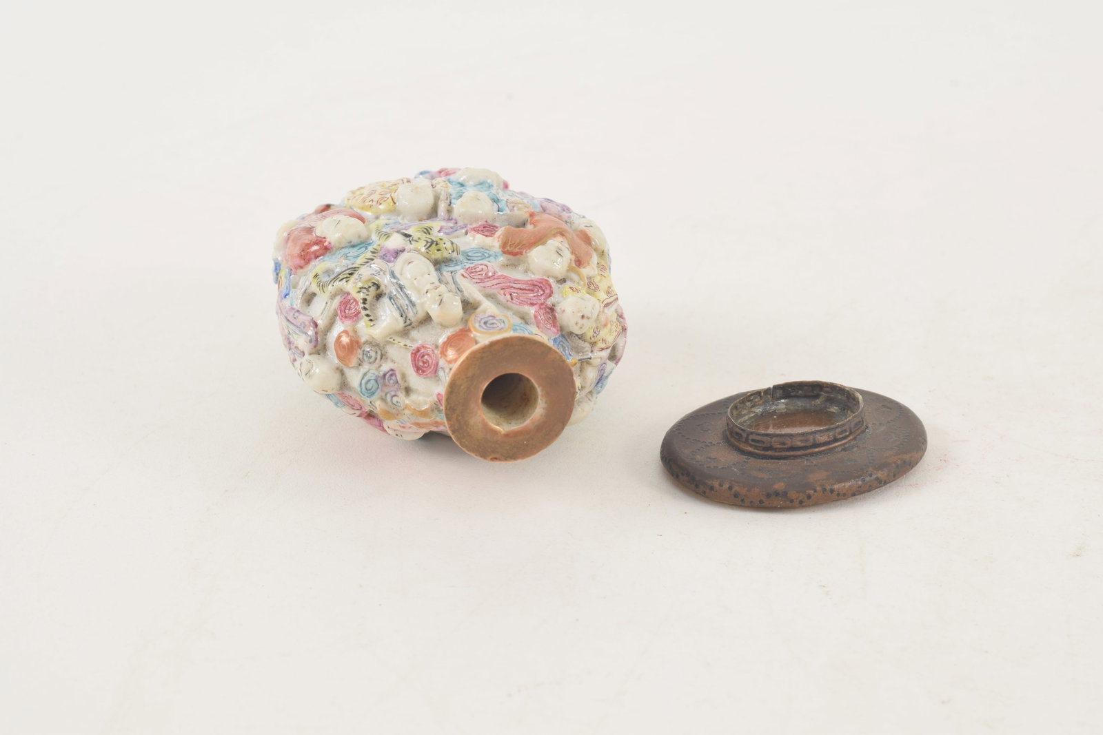 19th century Chinese porcelain snuff bottle. Polychrome carved and molded with a design of the - 5
