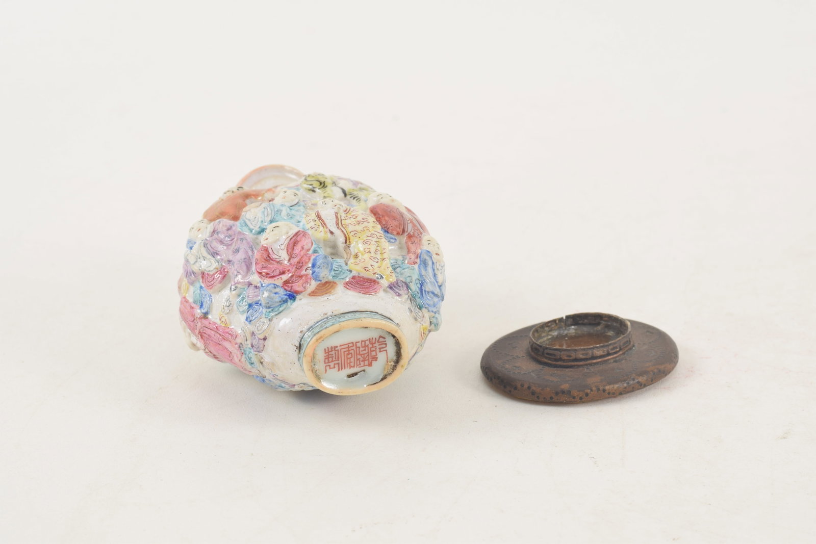19th century Chinese porcelain snuff bottle. Polychrome carved and molded with a design of the - 6