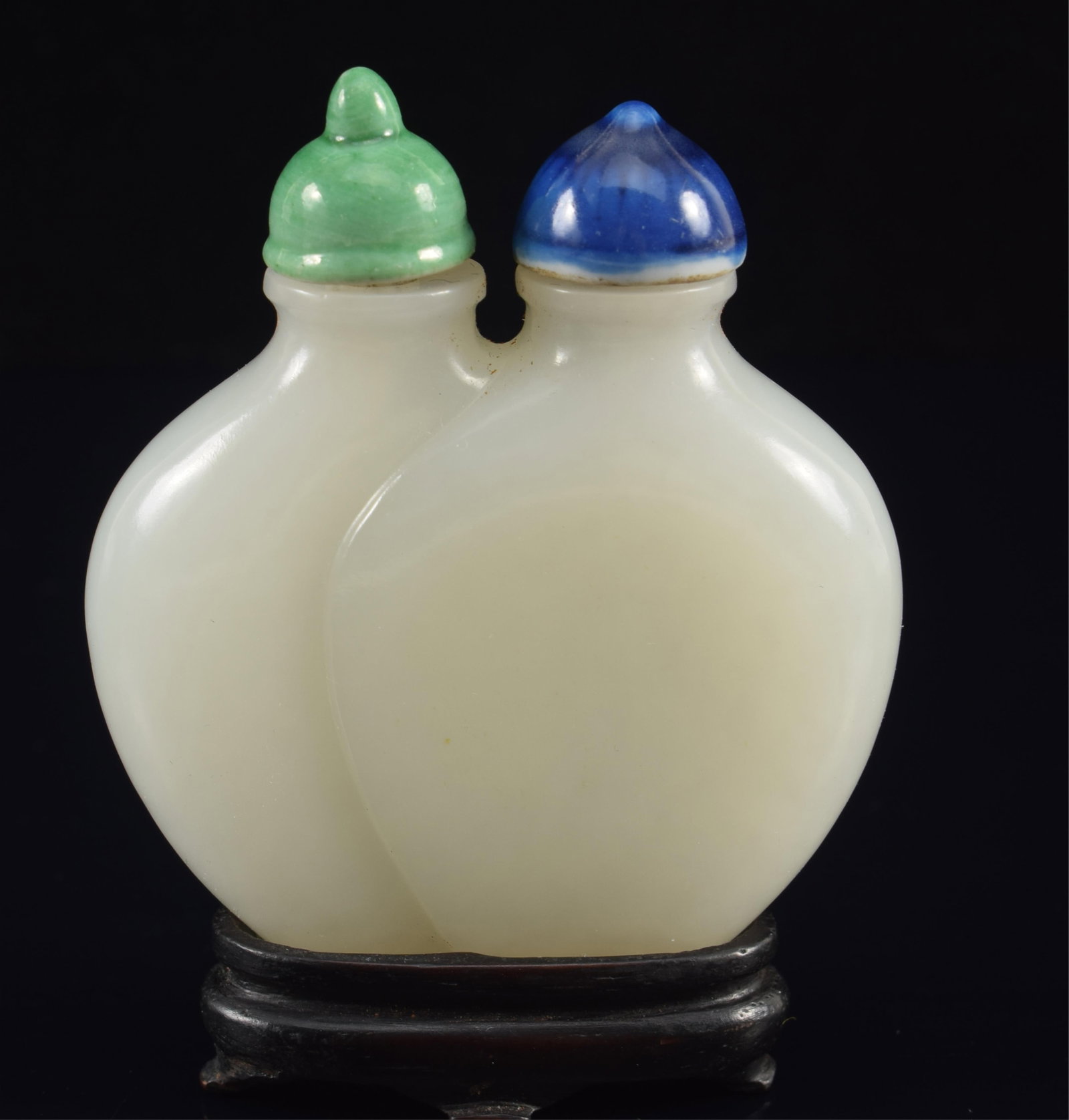 Double snuff bottle. China. 18th century. Pure white jade, well hollowed. Lids of lapis and (1 of 6)
