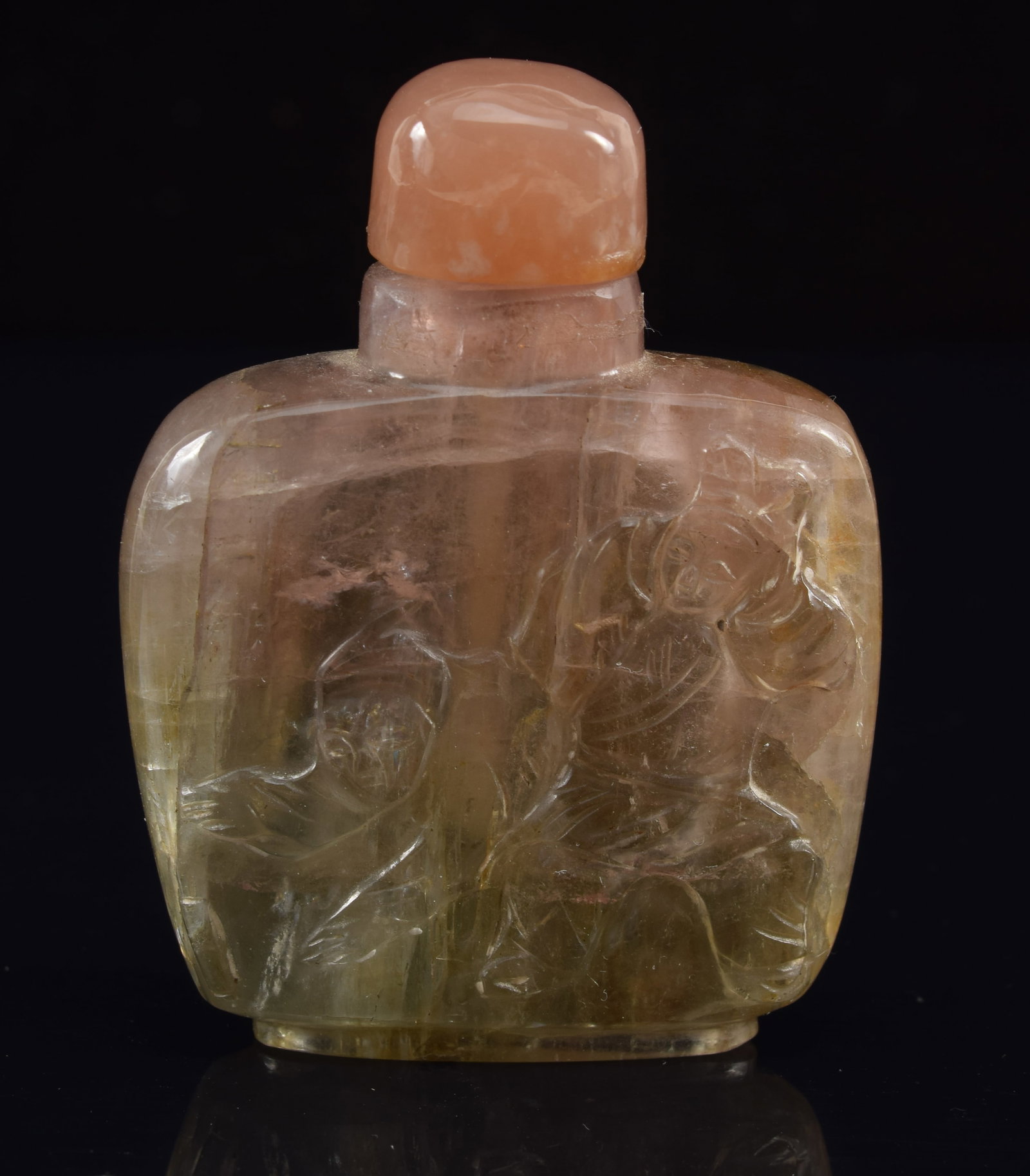 19th century Chinese carved tourmaline flat form snuff bottle. Figural decoration. Stone with slight: 19th century Chinese carved tourmaline flat form snuff bottle. Figural decoration. Stone with slight pink hue. 2.25in high.
