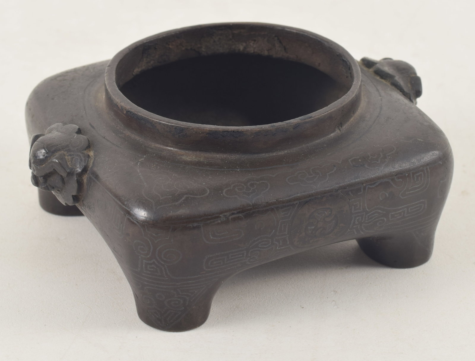 Bronze incense burner. China. 18th century. Shih So style. Square form with foo dog handles. 4in. (1 of 7)