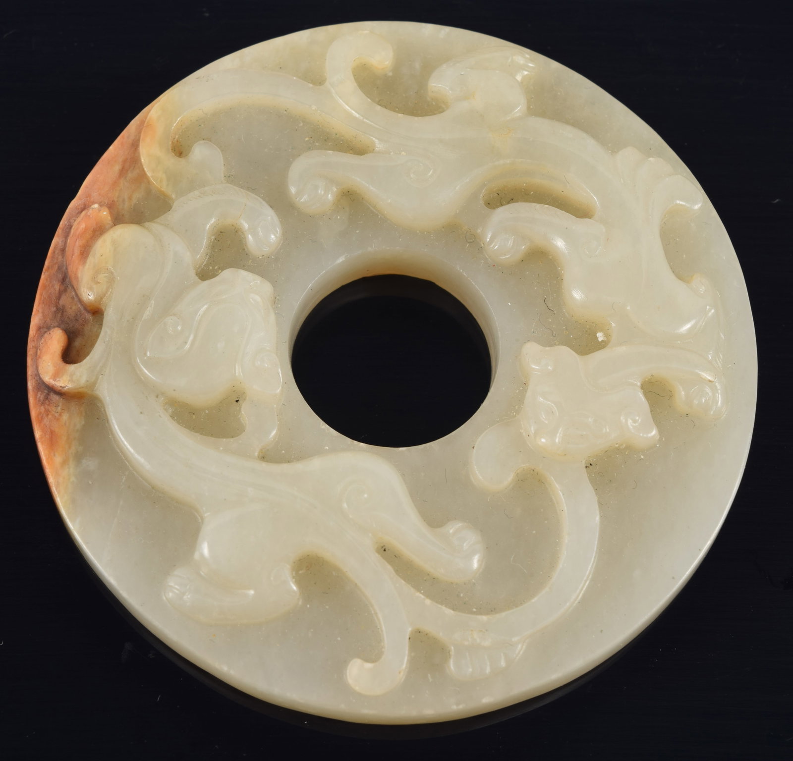 Archaic style jade pi. China. 18th century or earlier. Surface carved with chih lung, reverse carved (1 of 4)