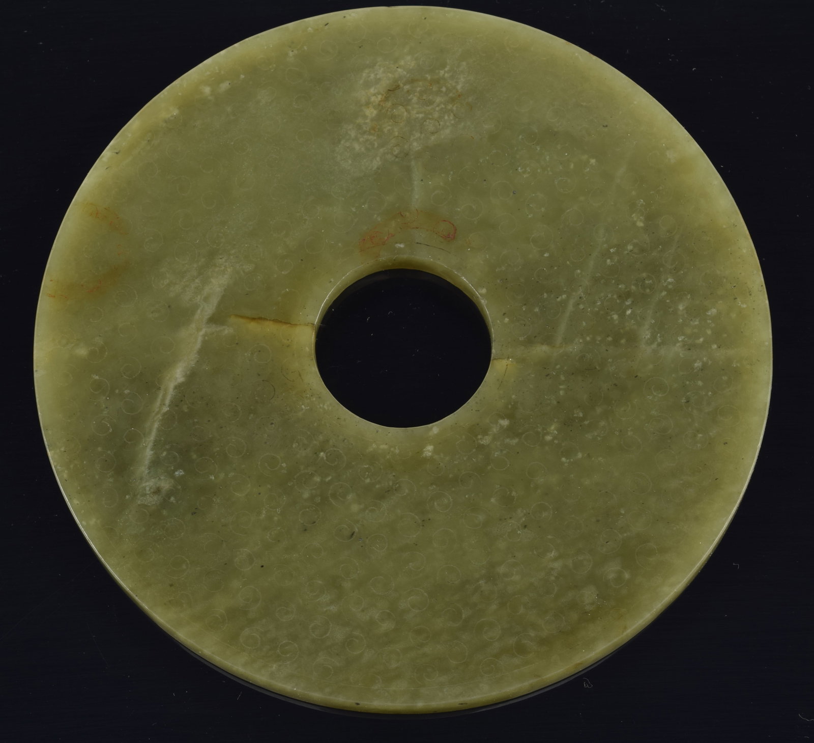 Archaic jade disc. China. Dark green color. Surface carved. 5.5in diameter. (1 of 4)