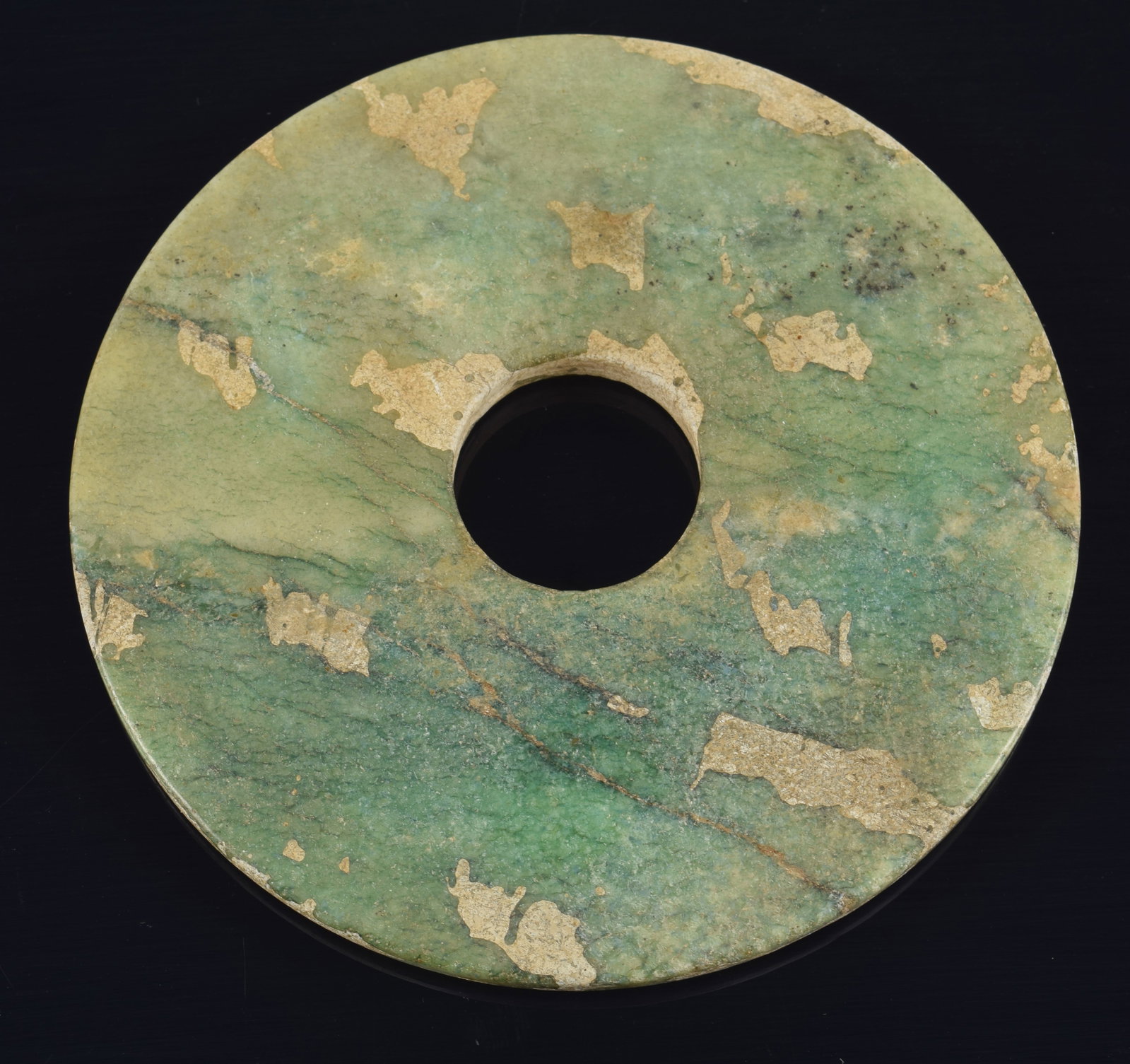 Archaic jade disc. China. Dark green and celadon colors. 4 5/8in diameter. (1 of 4)