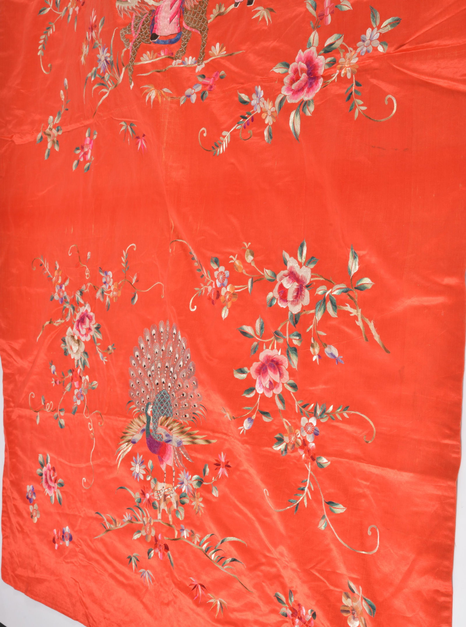Chinese silk embroidered textile. Figural and floral decoration on a red ground. 72 x 46in. - 2