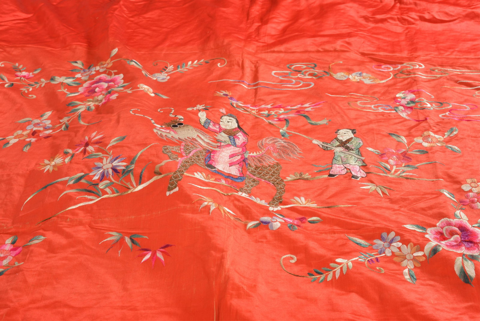 Chinese silk embroidered textile. Figural and floral decoration on a red ground. 72 x 46in. - 5