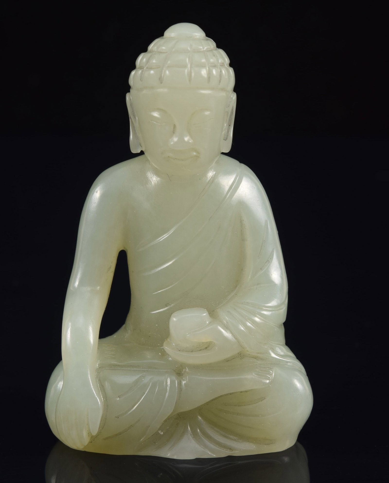 Jade image of the buddha. China. 19th century. Highly translucent celadon color. 2.25in. (1 of 7)