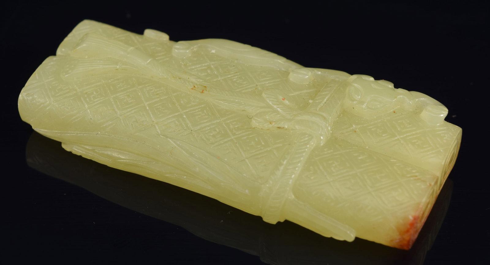 Yellow jade carving. China. 18th century. Carved as a pair of brocade mounted scrolls. 2.75in.: Yellow jade carving. China. 18th century. Carved as a pair of brocade mounted scrolls. 2.75in.