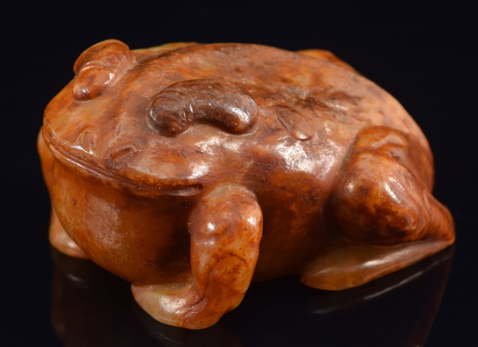 Jade frog. China. 19th century. Pale celadon stone with most of surface in red and brown markings. (1 of 6)