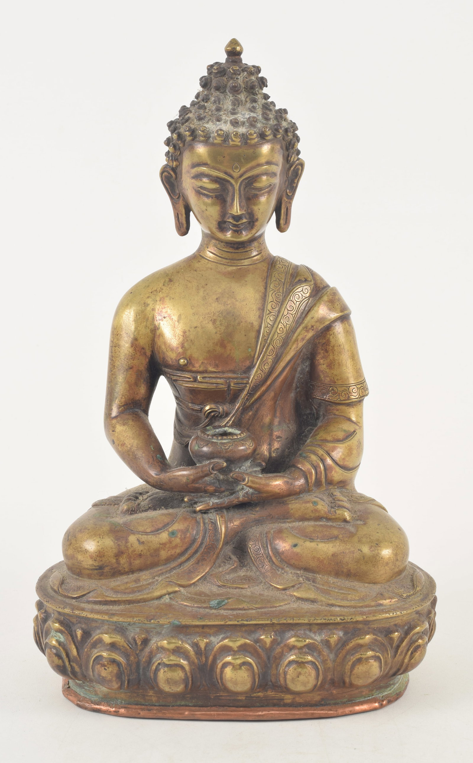 19th century or earlier gilt bronze seated Shakyamuni buddha. Possibly replaced copper base. 10.25in (1 of 9)
