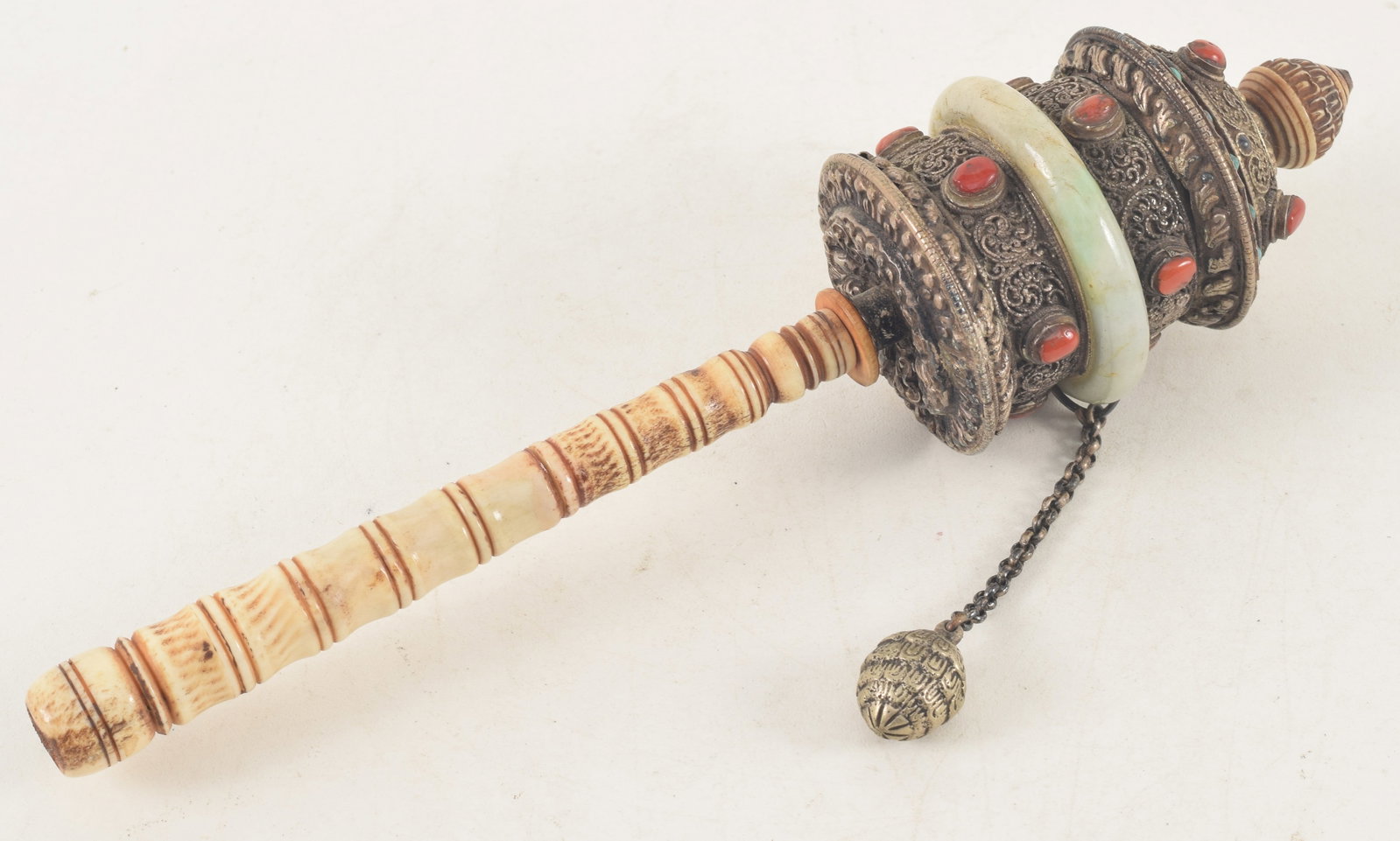 Prayer wheel. Tibet. 19th century. Silver, bone, jade, carnelian and turquoise. 9in. (1 of 5)