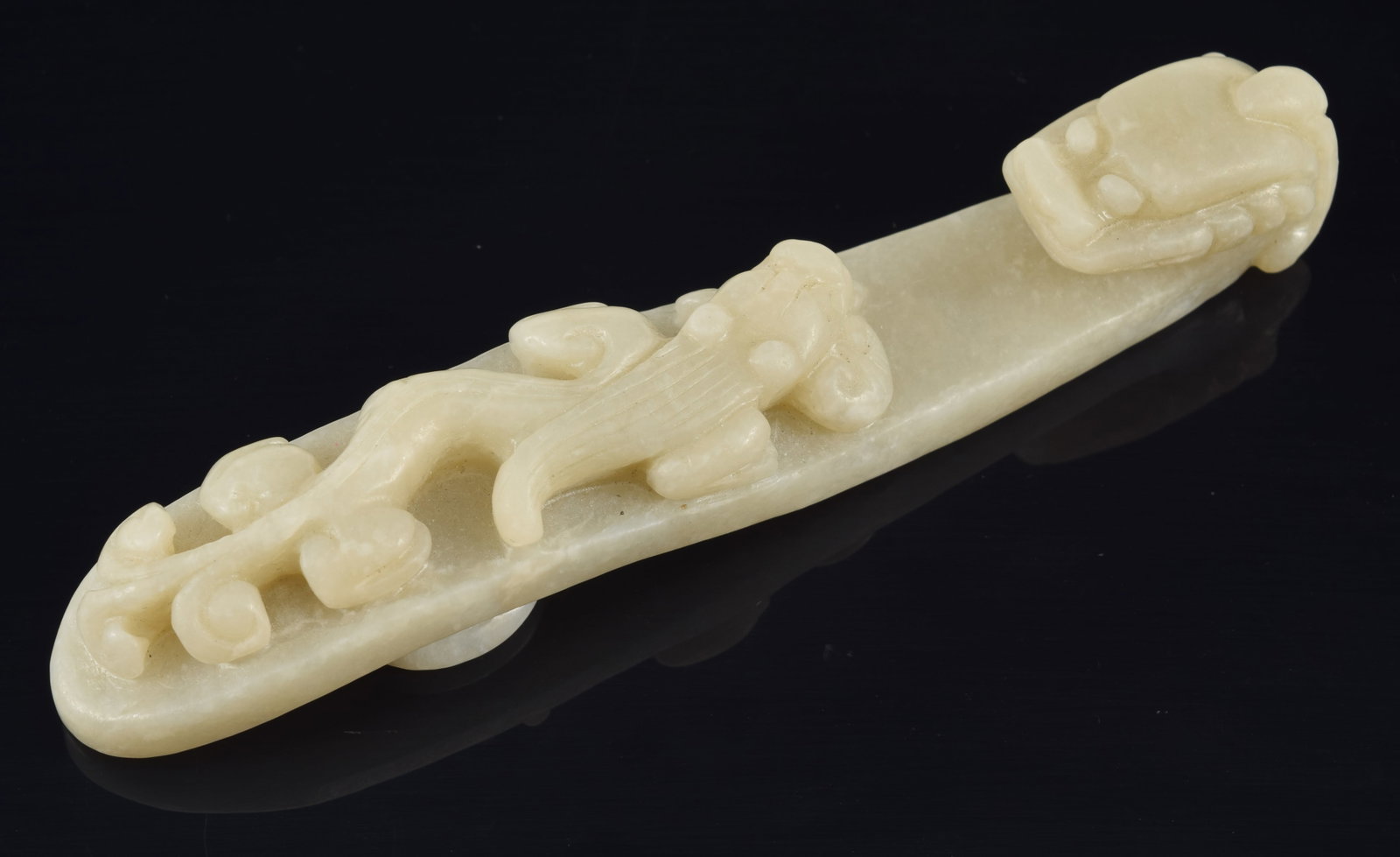Jade garment hook. China. Late 19th/early 20th century. Carved with a dragon. 5.5in length. (1 of 4)