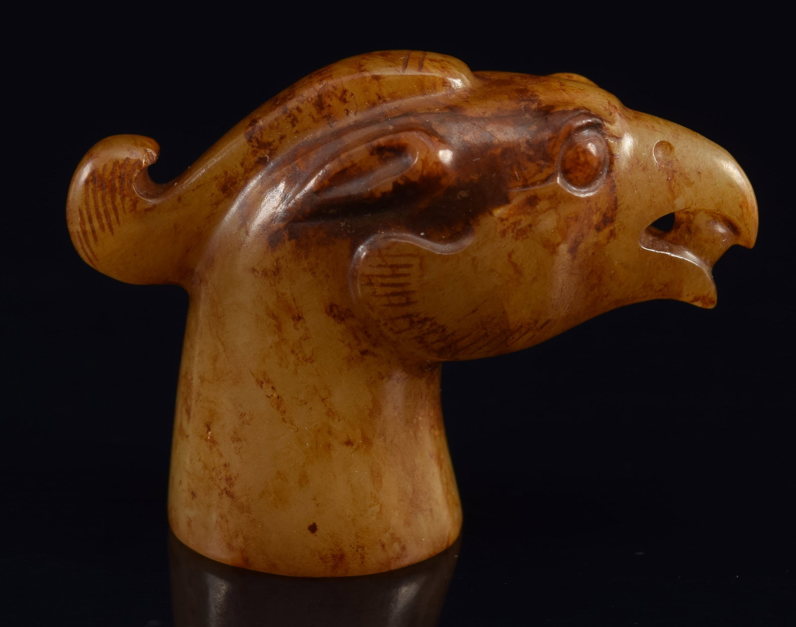 Jade finial. China. 16th century or earlier. Brownish colored stone in the form of a mythical: Jade finial. China. 16th century or earlier. Brownish colored stone in the form of a mythical animal. 1.5in.