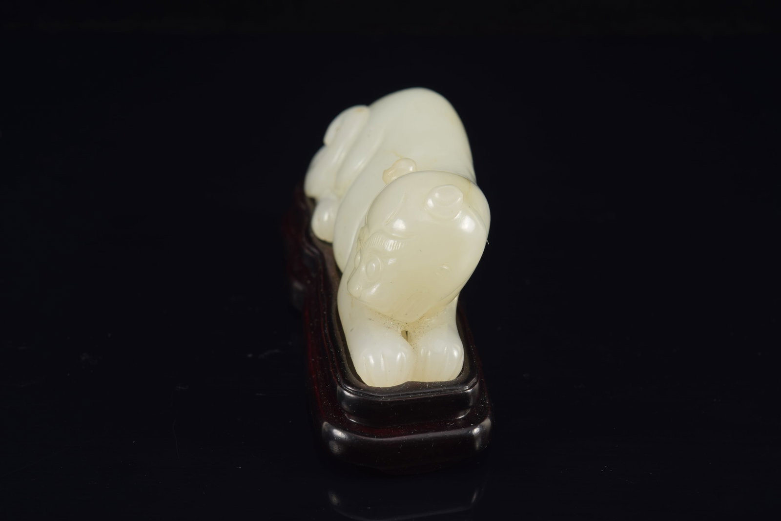 Jade tiger. Pure white color. China. 18th century. Fitted stand. 3.5in length. - 2