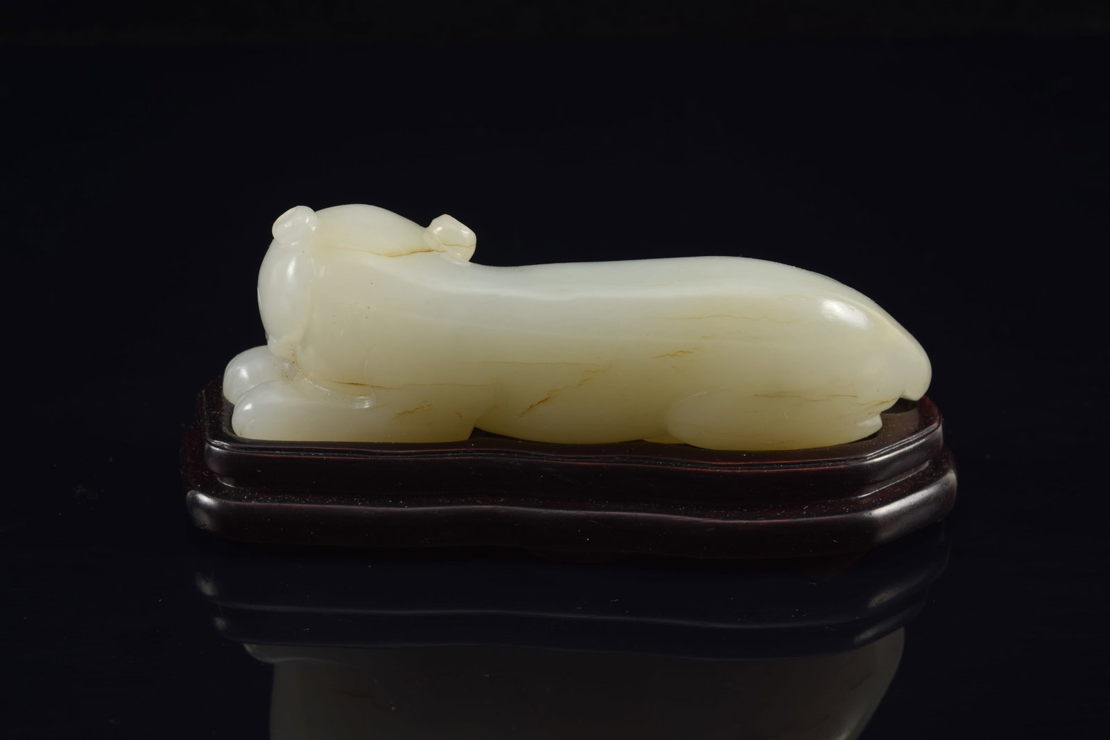 Jade tiger. Pure white color. China. 18th century. Fitted stand. 3.5in length. - 3