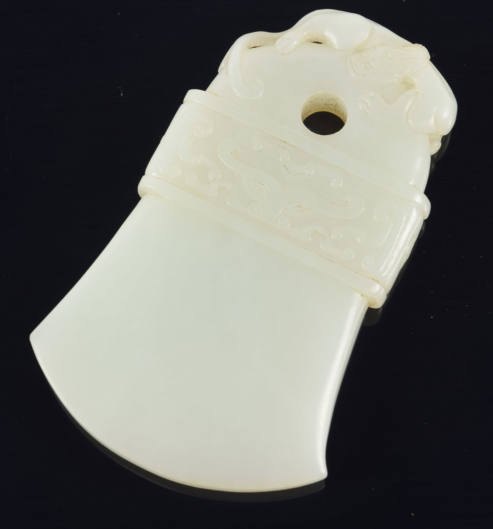 Jade axe. China. Chien Lung period (1735-1796). Archaic form with a chih lung finial and toatie mask (1 of 6)