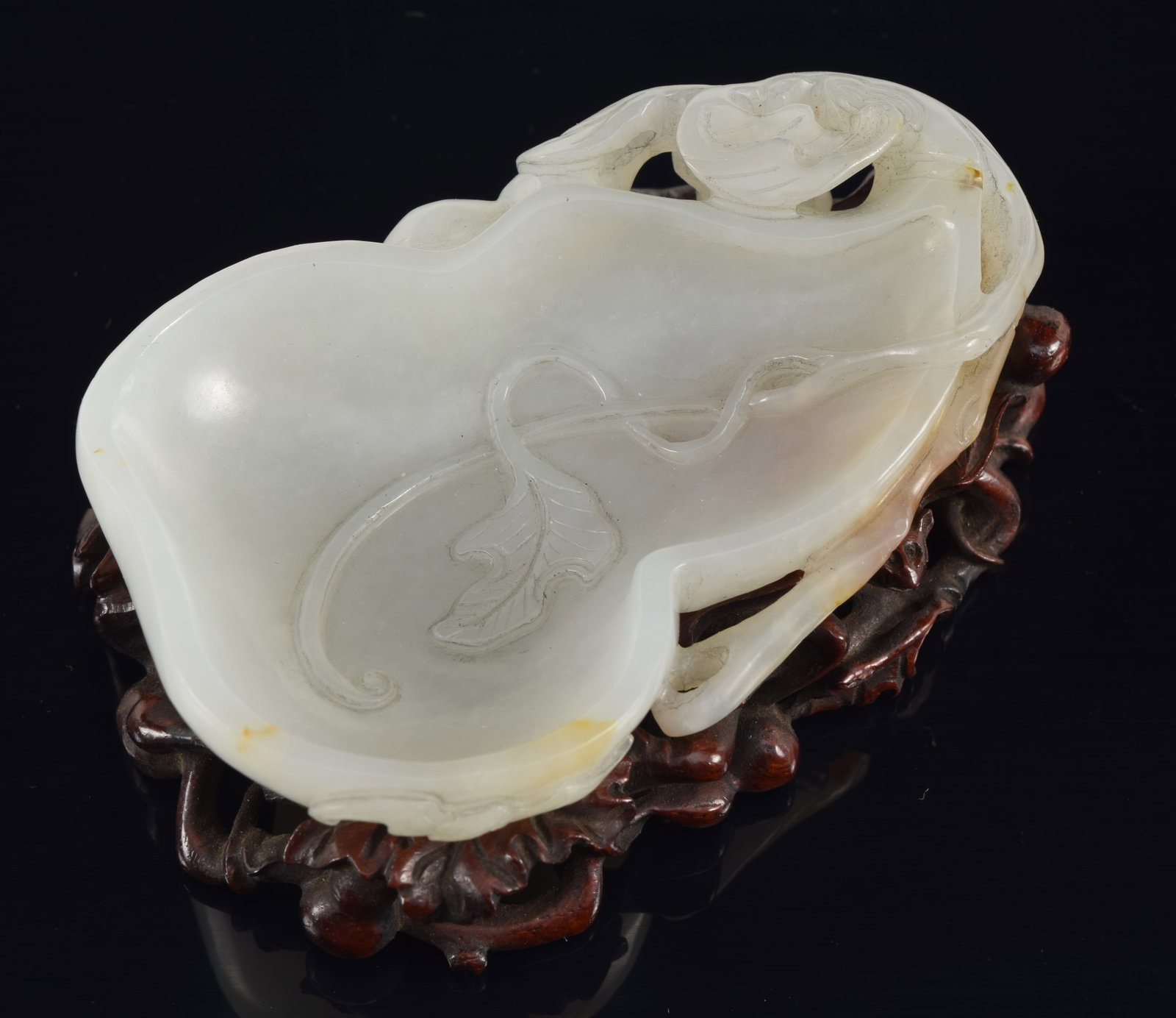 Jade water coupe. China. 18th century. Highly translucent pure white stone with russet markings. (1 of 7)