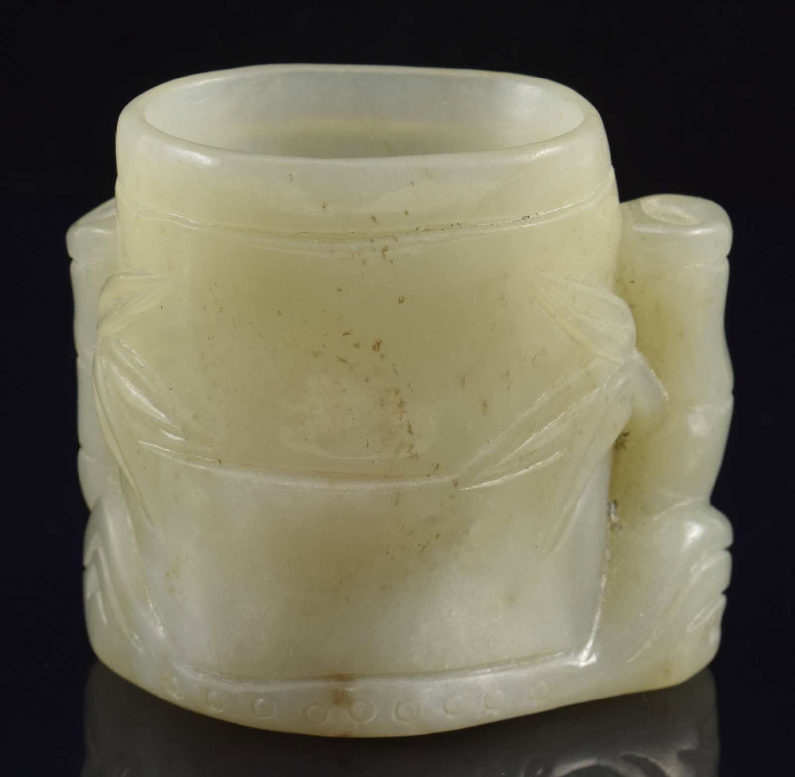 Jade brush holder. China. Early 20th century. Carved as bamboo. 2 3/8in high.: Jade brush holder. China. Early 20th century. Carved as bamboo. 2 3/8in high.