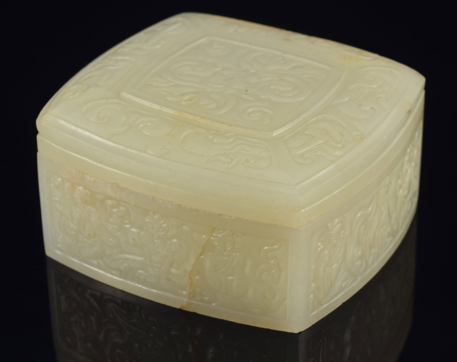 Jade box. China. 18th century. Pure white jade. Rounded square form. Surface carved with archaic (1 of 7)