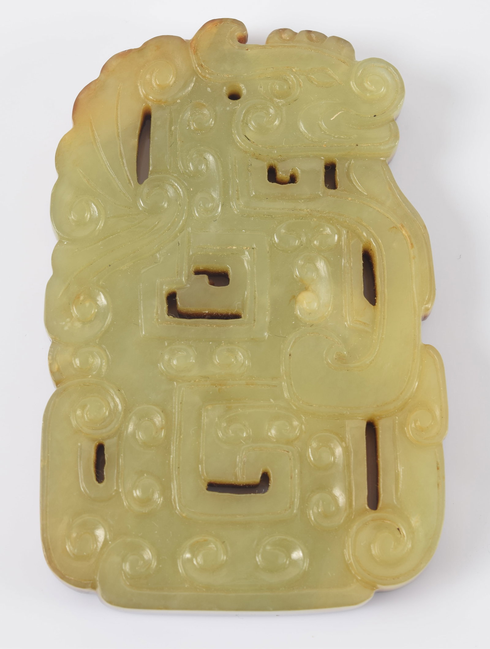 Jade pendant. China. 18th century or earlier. Yellow jade on one side, dark brown skin on the (1 of 5)