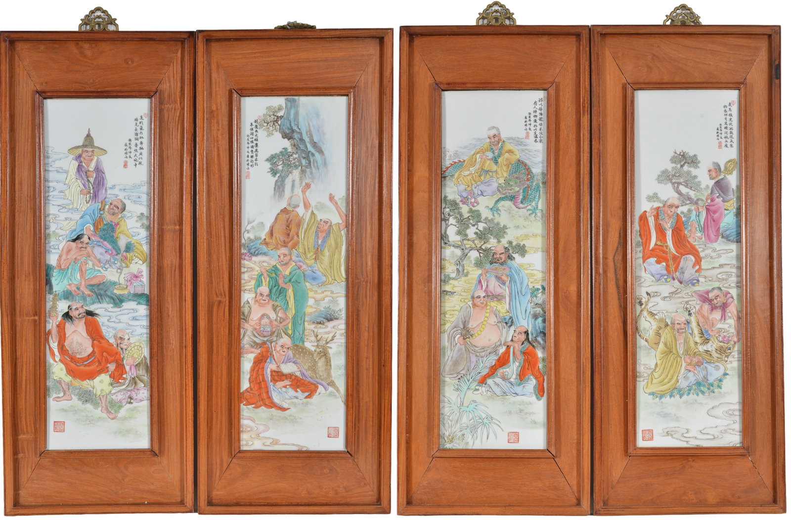 Set of 4 large 20th century Chinese porcelain plaques. Hardwood frames. Plaques depicting immortals: Set of 4 large 20th century Chinese porcelain plaques. Hardwood frames. Plaques depicting immortals in landscapes and seascapes. Inscriptions with red seals. Overall size: 39.5 x 15.5in.