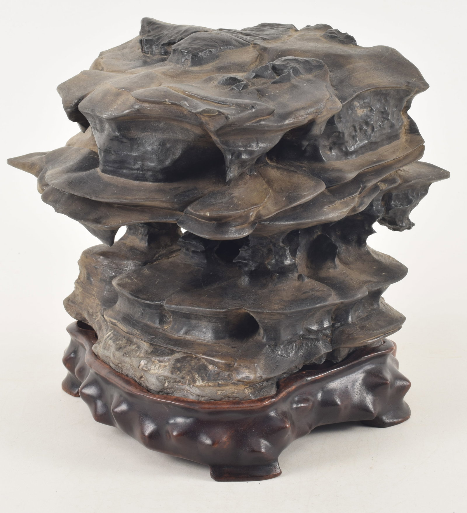 Chinese scholar's stone on fitted stand. Abstract tiered triangular form. 9.5in high overall. (1 of 7)
