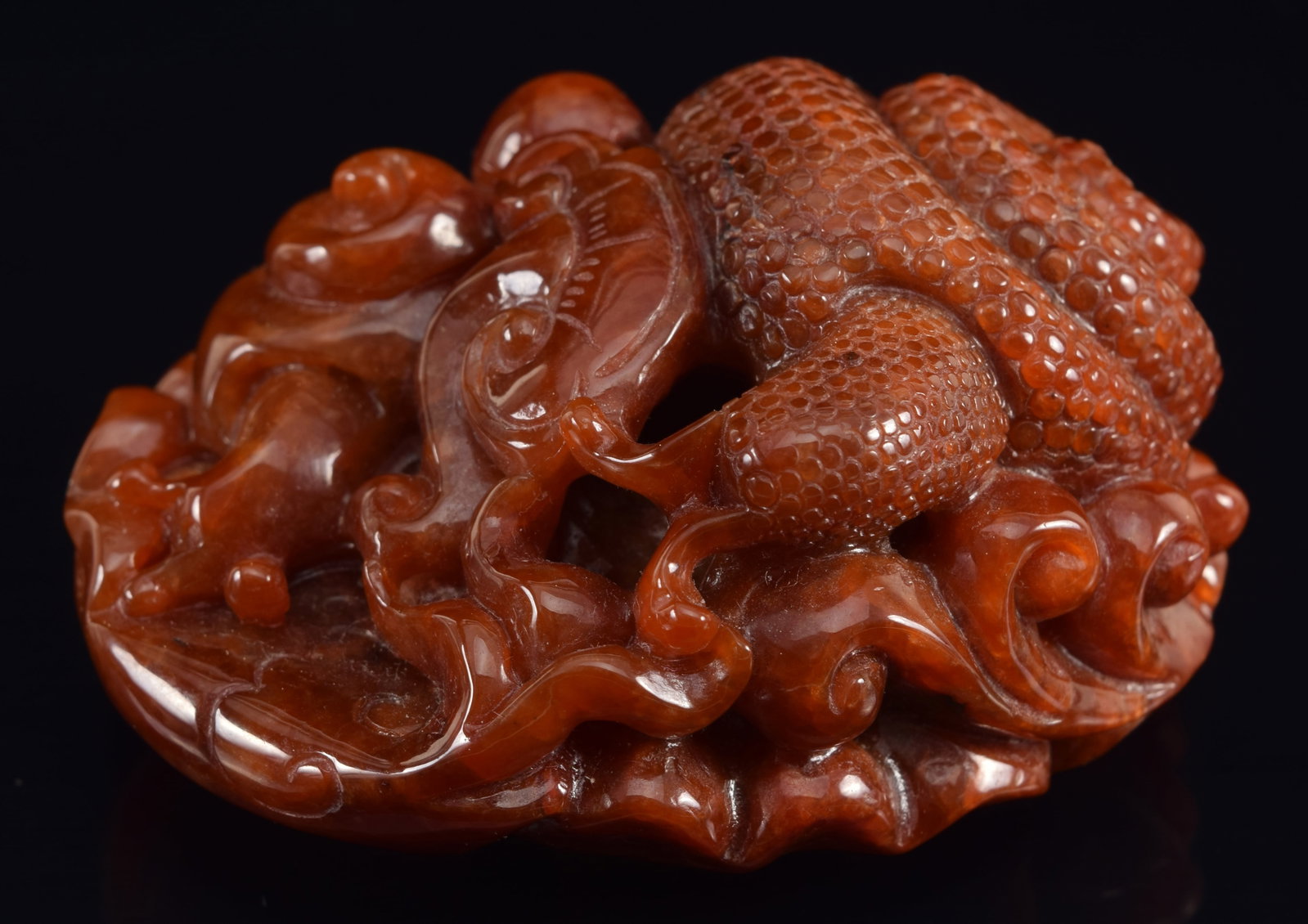 20th century Chinese carved rust colored jadeite bolder with snails and ling chih. 115 grams. 2 (1 of 7)