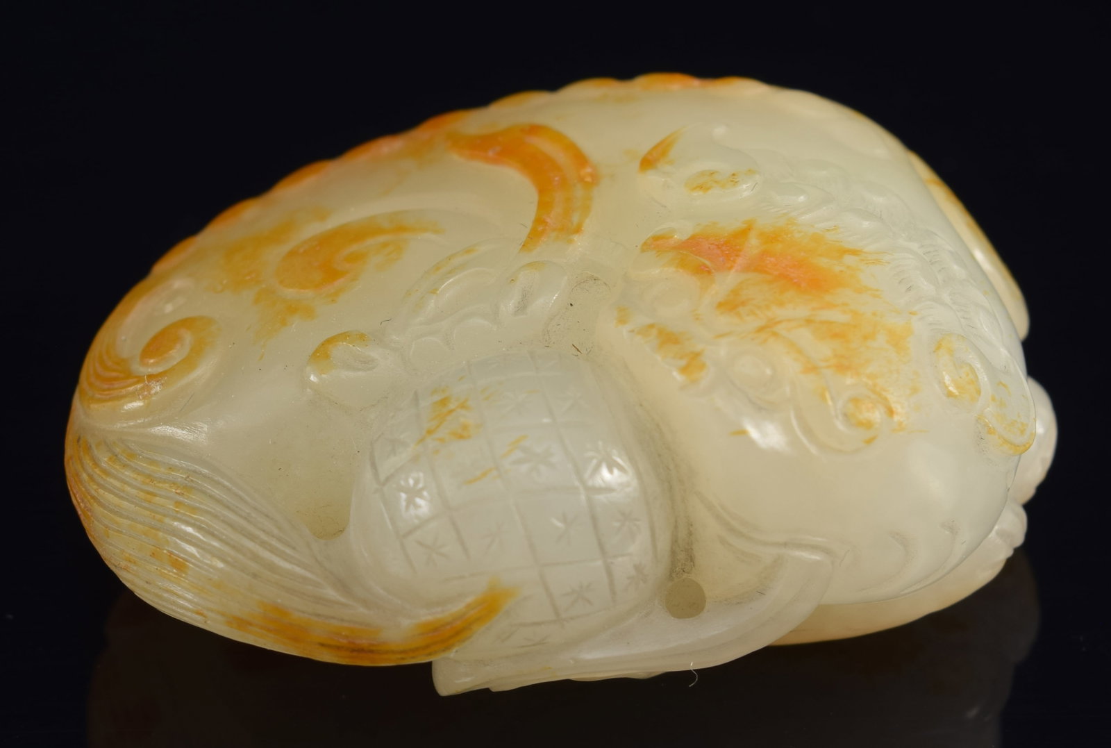 Jade foo dog. China. 18th century. Pure white stone with pronounced russet markings. 2in. (1 of 7)