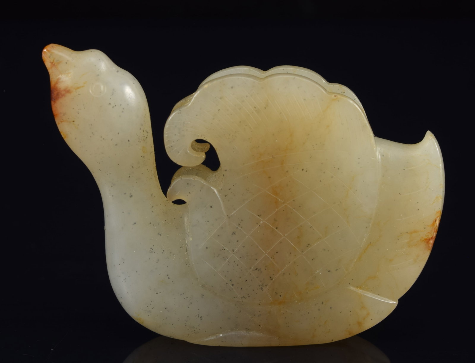 Jade carving of a goose. China. Liao period. Celadon jade with a single russet marking. 2in length. (1 of 8)