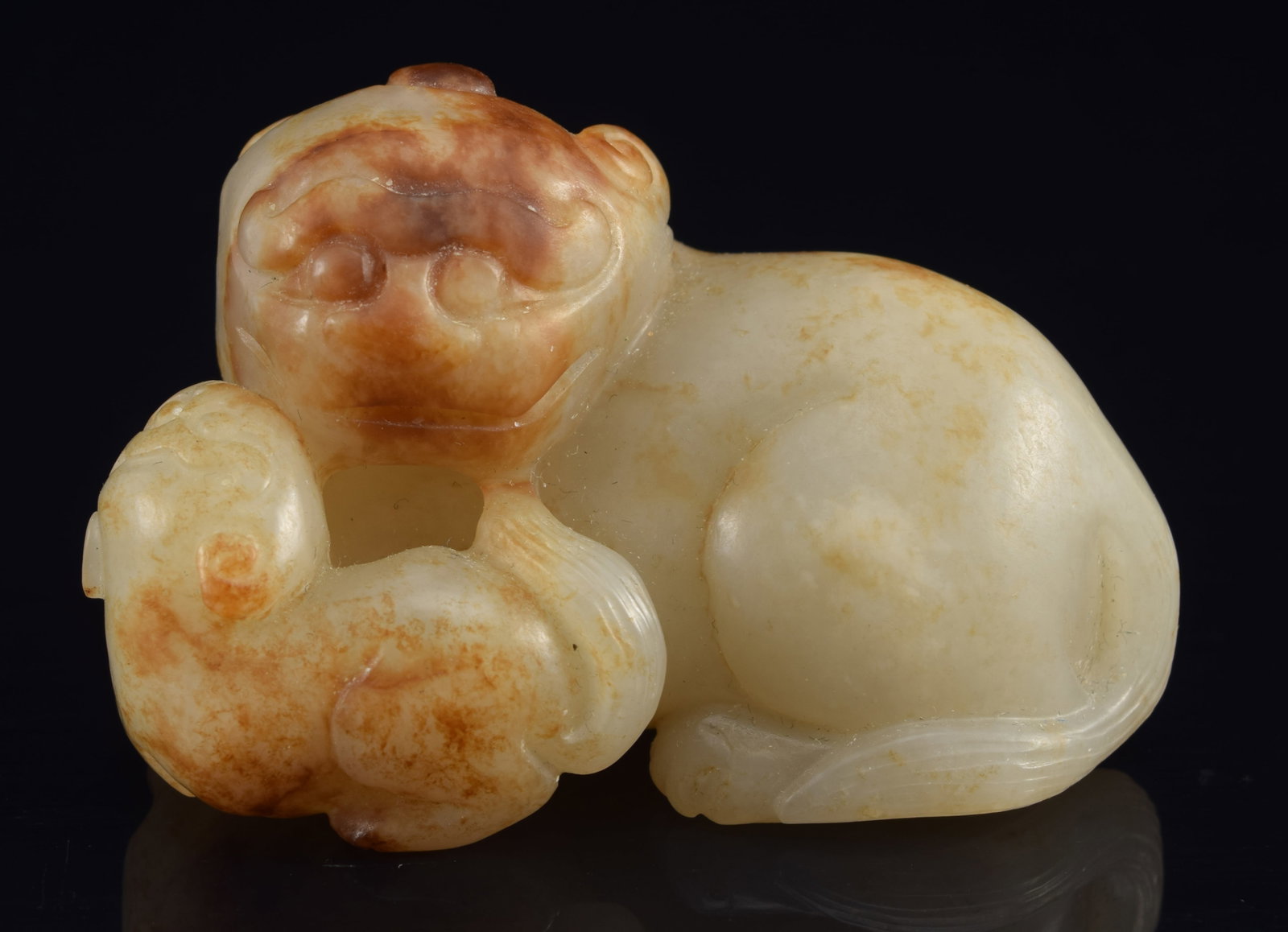 Jade group. China. 19th century. Foo dog and cub. Celadon stone with russet markings. 2in. (1 of 6)
