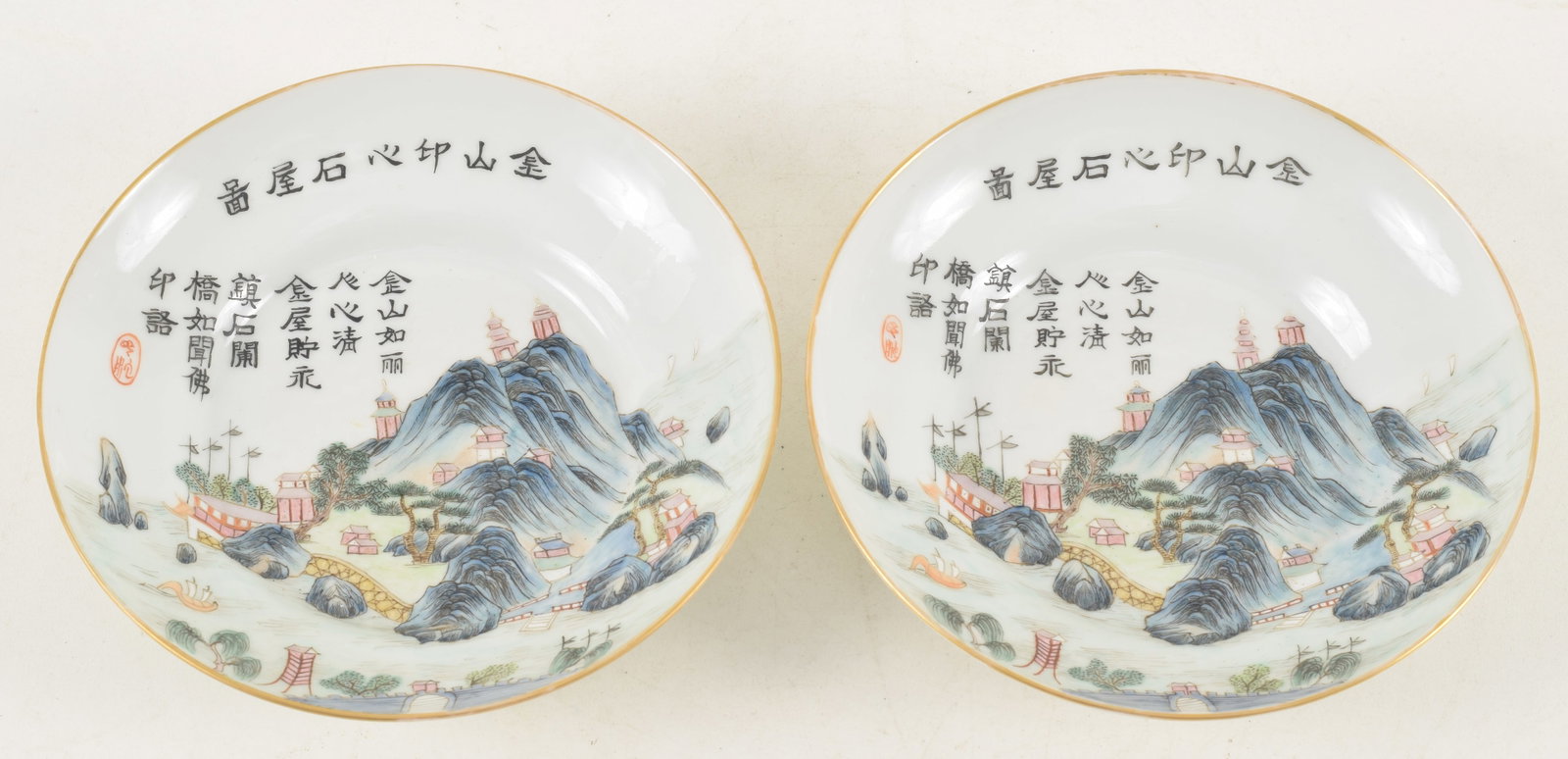 Pair of 20th century Chinese famille rose porcelain saucers. Extensive landscape decoration and: Pair of 20th century Chinese famille rose porcelain saucers. Extensive landscape decoration and inscriptions with red seals. Daoguang mark on base. 5in diameter.