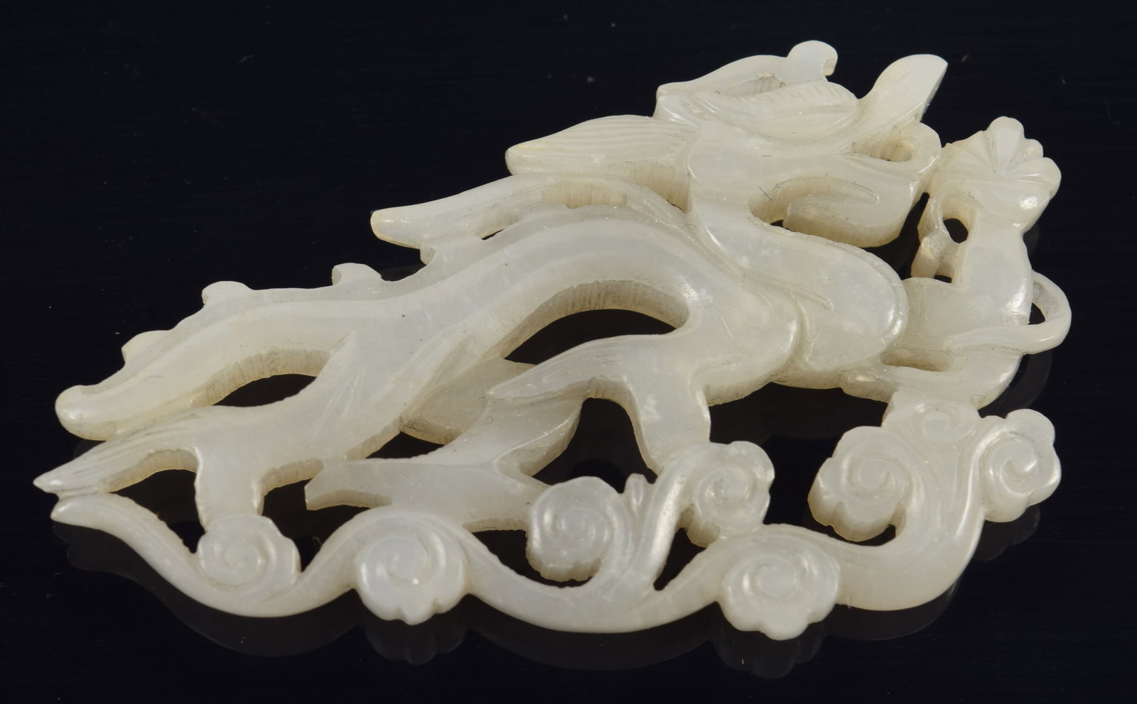 Jade carving. China. Liao period. Dragon and clouds. Pale celadon color stone. 2in length. (1 of 4)