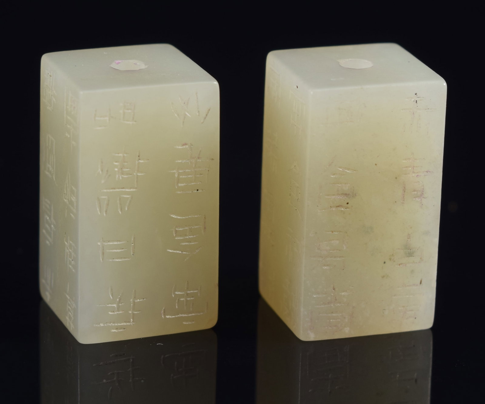 Pair of rectangular jades. China. 19th century. Carved with inscriptions. 0.5in length.: Pair of rectangular jades. China. 19th century. Carved with inscriptions. 0.5in length.
