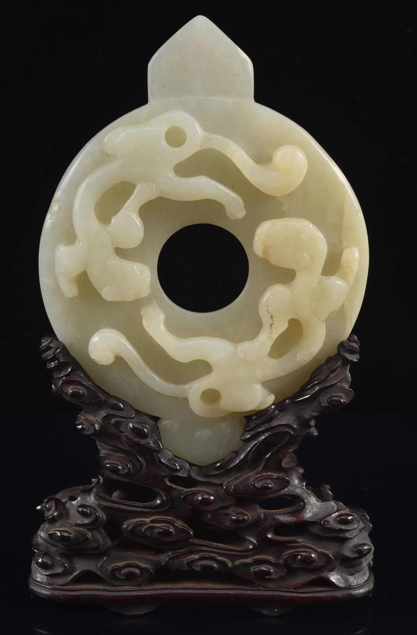 Jade pi kuei. China. 18th century. Surface carved with chih lung. Pale celadon jade color. Fitted: Jade pi kuei. China. 18th century. Surface carved with chih lung. Pale celadon jade color. Fitted stand. 5.25in of jade.