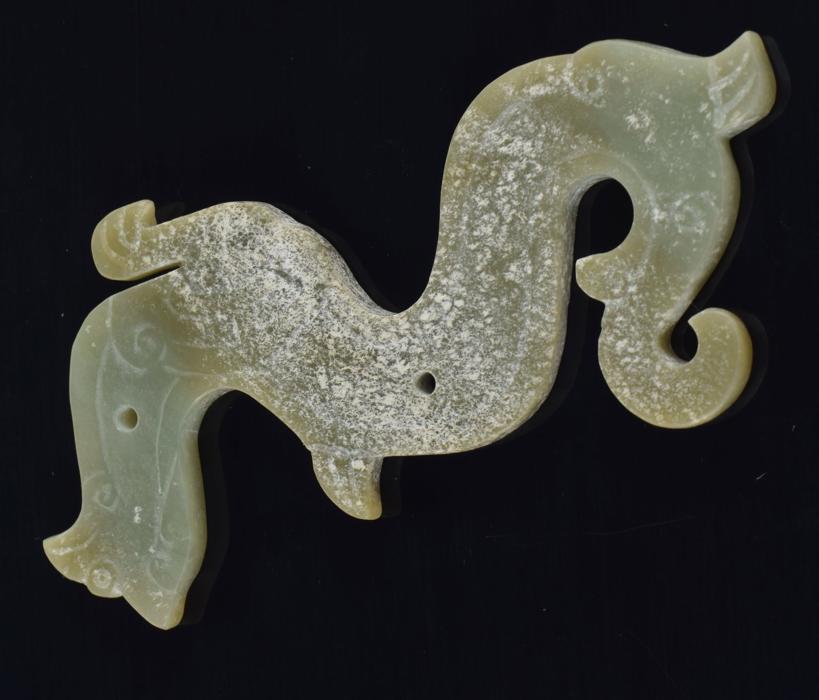 Archaic green jade carving of a phoenix. China. 4 1/8in length. (1 of 3)